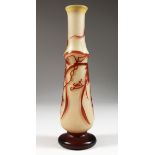 A SLENDER GALLE GLASS VASE, with grape and vine decoration. 10ins high.