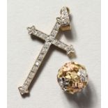 A 9CT GOLD DIAMOND SET CROSS AND BALL.