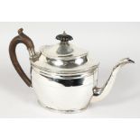 A GEORGE III OVAL TEAPOT, with ebony finial and handle. London 1803. Maker: Daniel Piers.