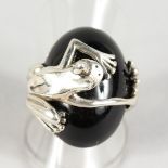 A SILVER RING MODELLED AS A FROG.