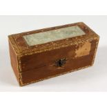 A GILT TOOLED LEATHER BOX INSET WITH A PIERCED JADE PANEL. 7ins long.
