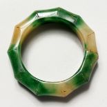 A CARVED JADE BAMBOO FORM BANGLE. 3.25ins diameter.