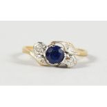 AN 18CT GOLD, SAPPHIRE AND DIAMOND RING.