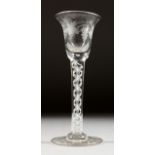 A GEORGIAN WINE GLASS, with inverted bell bowl etched with fruiting vines, with white air twist