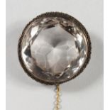 A LARGE CUT CIRCULAR CRYSTAL BROOCH.