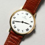 A GENTLEMAN'S CYMA WATCH with leather strap.