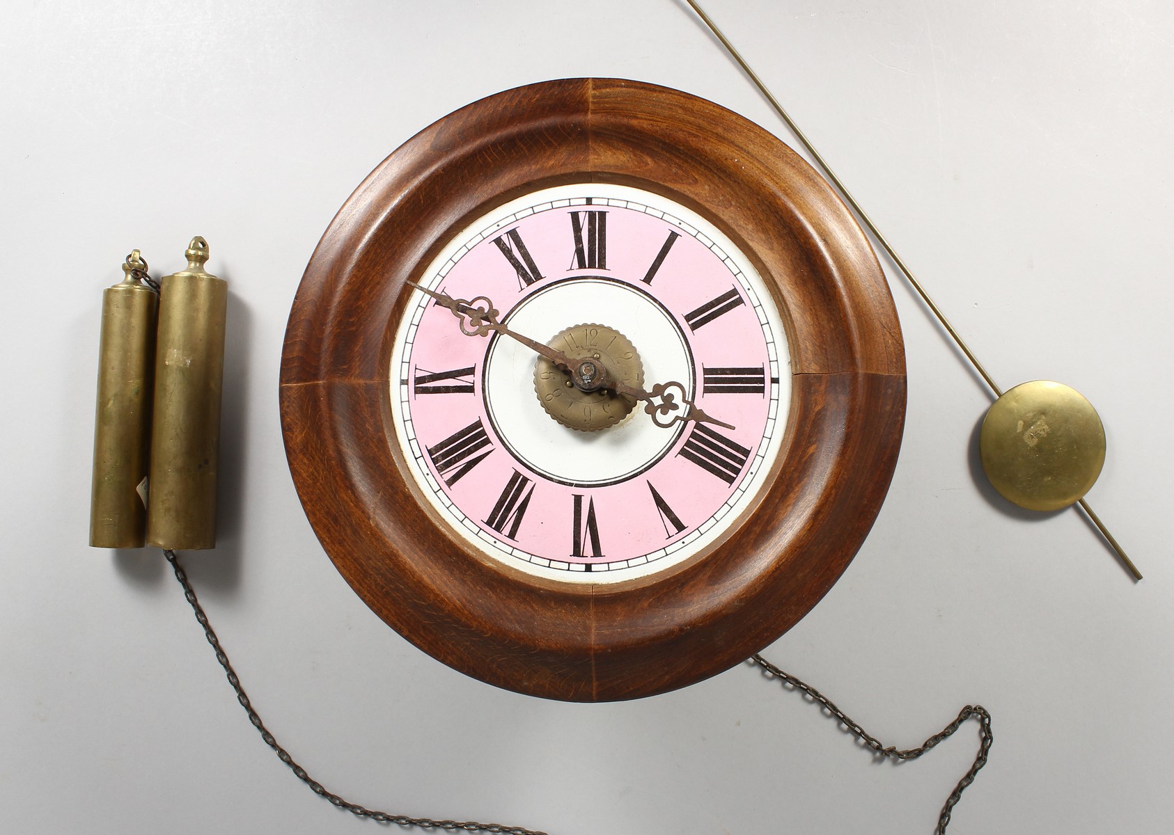 A HANGING WALL CLOCK.