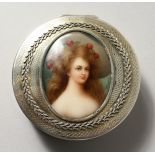 A GOOD CONTINENTAL SILVER CIRCULAR BOX, the hinged lid inset with a painted porcelain plaque of a