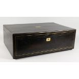 A LARGE 19TH CENTURY EBONISED BOX AND COVER with brass stringing. 23ins long.