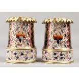 AN UNUSUAL PAIR OF 19TH CENTURY DERBY VASES, painted and gilded in Imari style.