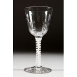 A LARGE GEORGIAN WINE GLASS with semi fluted bowl and white air twist stem, foot ground. 6ins high.