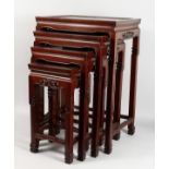 A CHINESE HARDWOOD NEST OF FOUR TABLES. Largest: 19ins wide x 27ins high.