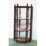 A GOOD 19TH CENTURY ROSEWOOD WALL SHELF, with a mirrored back, the shelves united by open barley