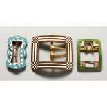 THREE LARGE ENAMEL BUCKLES.