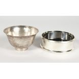 A SWEDISH HAMMERED SILVER BOWL, 4ins diameter, and A WINE COASTER (2).