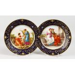 A GOOD PAIR OF 19TH CENTURY VIENNA PLATES, rich blue and gilt ground, with classical scenes.