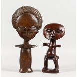 TWO AFRICAN CARVED WOOD DOLL FIGURES. 10ins and 8ins long.