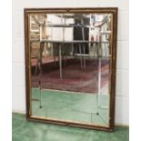 A DECORATIVE WALL MIRROR, with bevelled mirror plates. 3ft 2.5ins x 2ft 4.5ins.