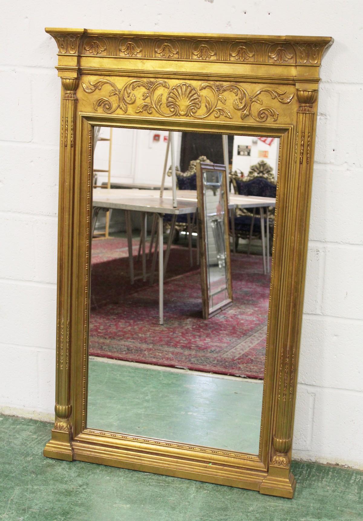 A MODERN GILT FRAMED PIER MIRROR IN THE REGENCY STYLE.