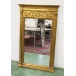 A MODERN GILT FRAMED PIER MIRROR IN THE REGENCY STYLE.