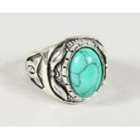 A SILVER RING SET WITH A TURQUOISE.