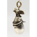 A GOOD MODERN RUSSIAN SILVER EGG SHAPE PENDANT, mounted with a helmet. 1.5ins high.