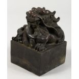 A LARGE CHINESE BRONZE DRAGON SEAL. 3.5ins wide.