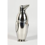 A SILVER PLATE PENGUIN COCKTAIL SHAKER.