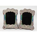 A PAIR OF ART NOUVEAU STYLE SILVER PHOTOGRAPH FRAMES, with enamel decoration, embossed with a