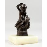 A GOOD SMALL BRONZE OF A PUTTI RIDING A TORTOISE. 4ins high, on a square onyx base.