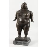 A BRONZE STANDING FEMALE NUDE, on a marble base. 14.5ins high.