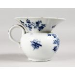 AN 18TH CENTURY MEISSEN BLUE AND WHITE SPITTOON. Cross swords mark in blue. 3.5ins high.