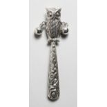 A SILVER NOVELTY OWL RATTLE.