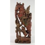 A LARGE INDIAN CARVED AND PAINTED WOOD GROUP, figures on a horseback. 31ins high x 12ins wide.