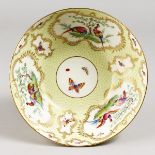 A RARE ROYAL WORCESTER YELLOW SCALE BOWL, painted with birds, signed J. Freeman, date code for