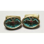 A PAIR OF MODERN RUSSIAN SILVER AND ENAMEL DECORATED DOUBLE EAGLE CUFFLINKS.