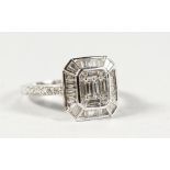 A GOOD 18CT GOLD DECO DESIGN DIAMOND AND BAGUETTE DIAMOND RING.