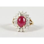 AN 18CT GOLD, RUBY AND DIAMOND DRESS RING.