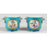 A GOOD PAIR OF 19TH CENTURY SEVRES PALE BLUE JARDINIERES, with panels of putti. Mark in blue. 4.5ins
