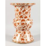 A CHINESE PORCELAIN BALUSTER SHAPED VASE, painted with orange and gilt flowers. 13is high.