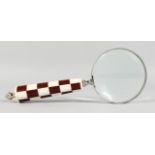 A LADIES MAGNIFYING GLASS with chequered handle.