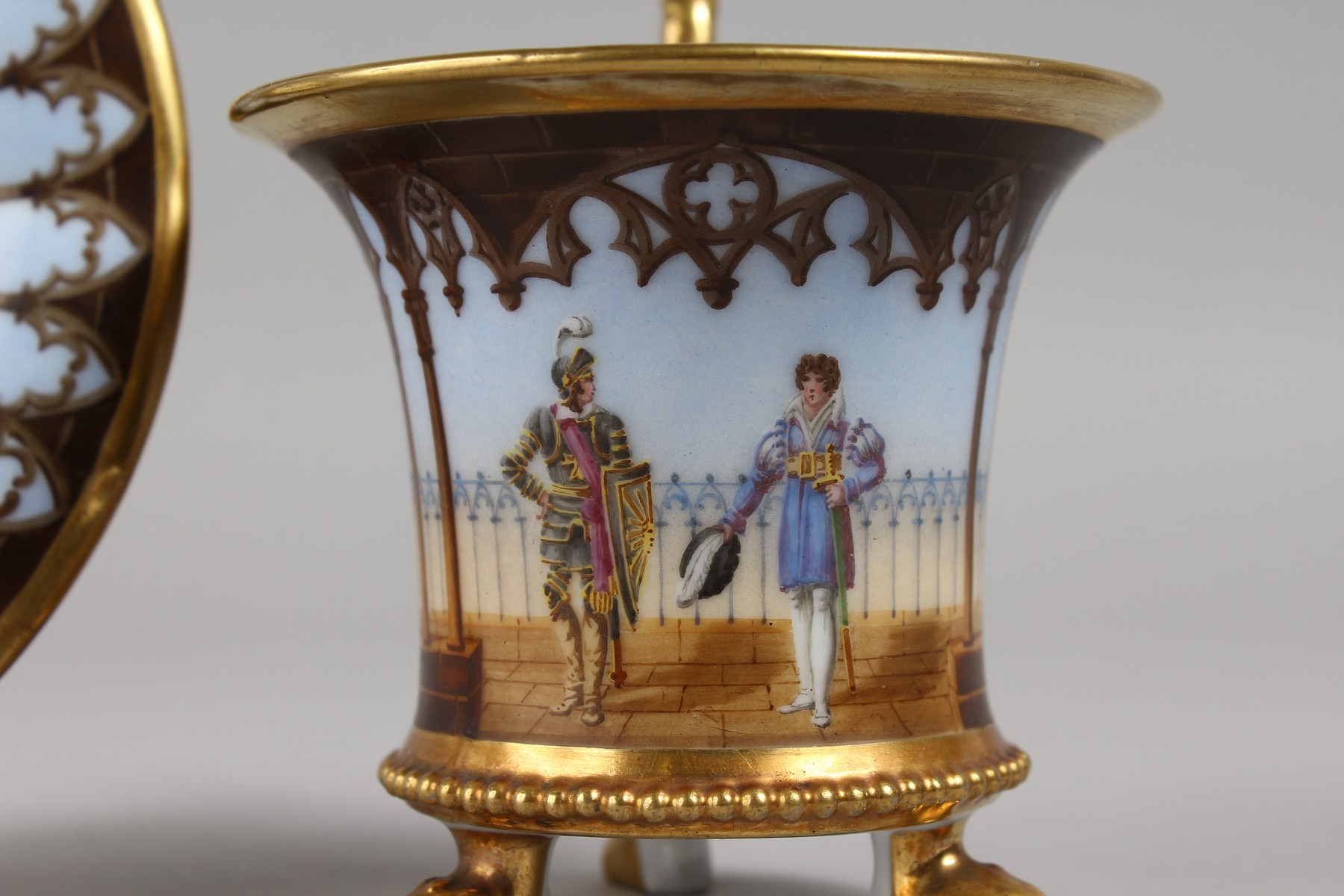 A DARTE PORCELAIN THREE FOOTED CABINET CUP AND SAUCER, painted with a soldier and a gentleman - Image 2 of 7