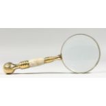 A MAGNIFYING GLASS.