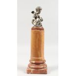 A GOOD SILVER PLATED CUPID on a marble column. 13.5ins high including column.