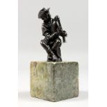 AFTER GIAMBOLOGNA A GOOD SMALL BRONZE OF A MAN PLAYING BAGPIPES. 3ins high, on a square marble