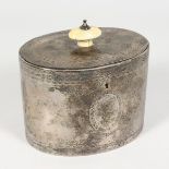 A VICTORIAN OVAL SILVER TEA CADDY, with engraved decoration. London 1857. Maker: JA. 3.5ins high.