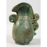 A CHINESE ARCHAIC STYLE CARVED JADE EWER. 8ins high.