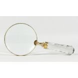 A LADIES MAGNIFYING GLASS with cut glass handle.