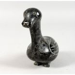 AN INUIT CARVED HARDWOOD GROUP OF A GOOSE. Etched on base E. 99. 5.5ins long.