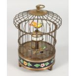 A NOVELTY BIRD CAGE CLOCK. 8ins high.